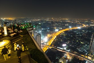 Guests at the Sky Bar on the Lebua State Tower with panoramic views