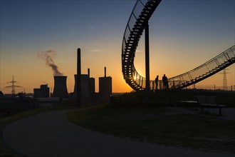 Power plant with part of the Tiger and Turtle sculpture at sunset