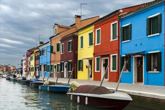 Colorful houses on canal with boats