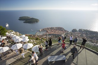 People enjoying the view of Dubrovnik and Lokrum Island from the viewing platform on Mount Srd