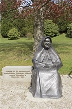 Statue of the religious foundress Maria Theresia Bonzel in front of the motherhouse of the Franciscan Sisters