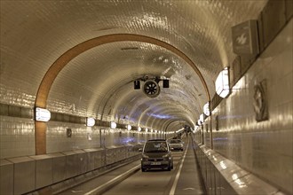 Cars drive through the old Elbe tunnel