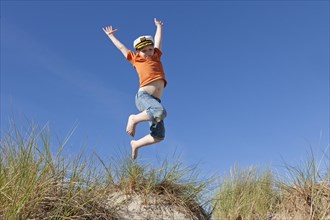 Boy wearing captain's hat