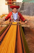 Peruvian working with loom