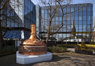Brewing kettle in front of the administration of the Warsteiner Brewery