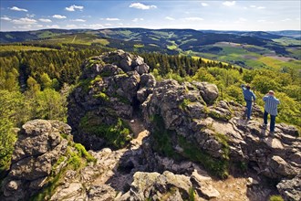 Two men looking across landscape from top of Bruchhausener Steine
