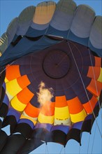 Pilot inflating hot air balloon with two burners