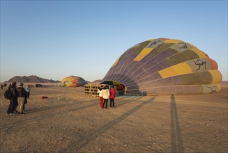 Preparing the hot-air balloons for take-off