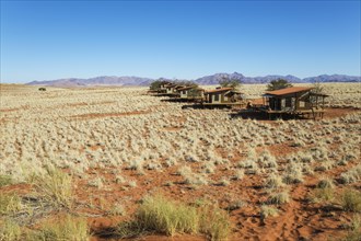 The chalets of the exclusive Wolwedans dunes lodge in a beautiful desert setting at the edge of the Namib Desert