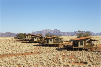 The chalets of the exclusive Wolwedans dunes lodge in a beautiful desert setting at the edge of the Namib Desert