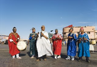 Musicians in colourful clothes at the Jemaa el-Fnaa square in Marrakesh