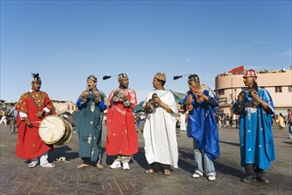 Musicians in colourful clothes at the Jemaa el-Fnaa square in Marrakesh