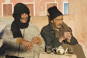 Two Berber men in Tafraoute drinking mint tea