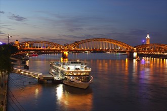 Hohenzollern Bridge and pier on the Rhine at dusk