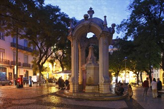 Largo do Carmo square with drinking fountain Chafariz do Carmo at dusk