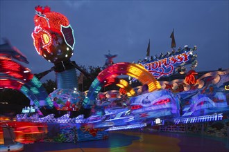 Octopussy ride on the fun fair Bremer Freimarkt at dusk