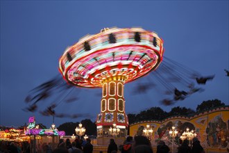 Chairoplane on the fun fair Bremer Freimarkt at dusk