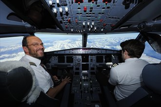 Pilot and copilot in cockpit