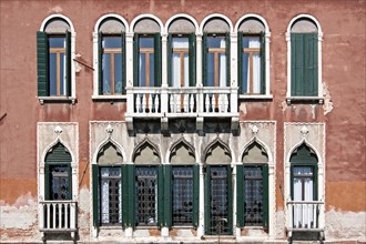House facade with windows in a Venetian style