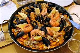 Paella pan with seafood in a restaurant