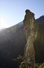 Sport climber on a rocky pinnacle