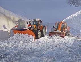 Snowplow and tractor removing snow