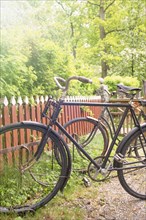 Rural scene with old retro bikes in a bicycle rack