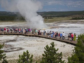 Tourists crowd the boardwalks in Yellowstone's Lower Geyser Basin