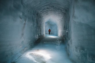 Tourist in a glacial cave