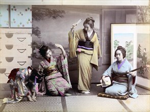 Four geishas making music
