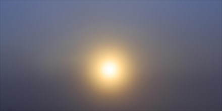 Sun penetrate through fog