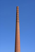 Old brick factory chimney