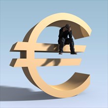 Man sitting on euro symbol