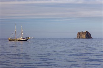 Strombolicchio island with sailboat