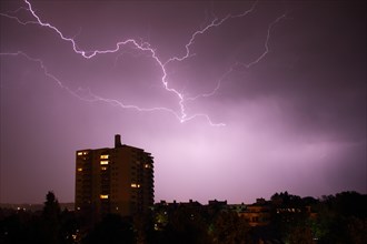 Lightning at night at a high-rise building