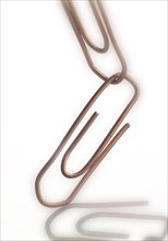 Two linked paperclips
