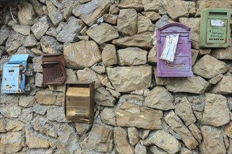 Post boxes on a stone wall