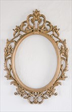 Baroque picture frame on a white wall