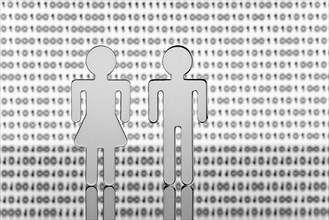 Two figures in front of binary code