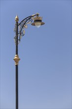 Street lamp with golden ornaments