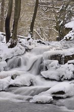 Waterfall with ice and snow