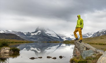Hiker stands on rock