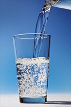 Water is being poured into a glass