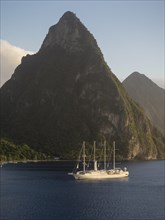 Sailing cruise ship Wind Star of Windstar Cruises in front of the volcanoes Gros Piton and Petit Piton