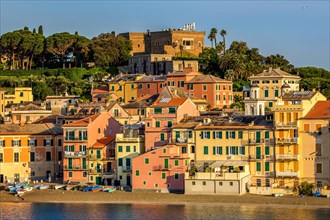 Colourful houses along Baia del Silenzio