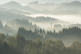 Morning mist over wooded hills