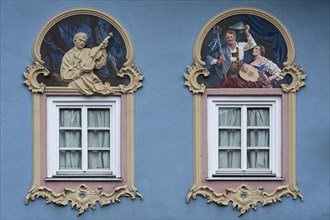 Decorative frames of windows with frescoes and relief of S. Pfeffer from 1992