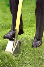 Foot on spade