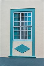Turquoise coloured windows with a diamond shape