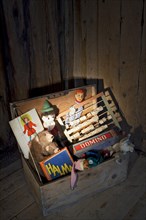 Old toys in a wooden chest